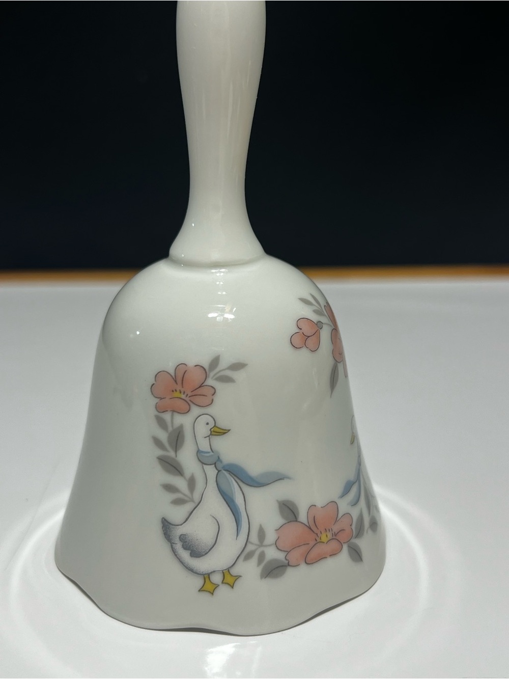 Vintage White Ceramic Goose Bell with Pink Floral Accent